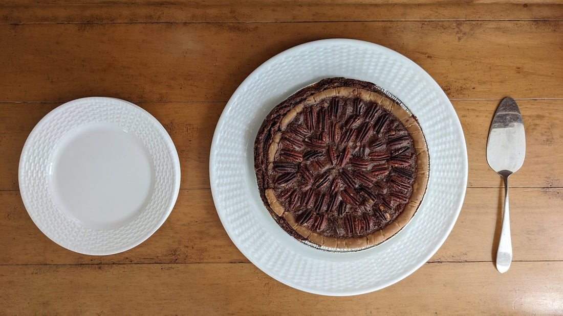 Pecan pie on a plate, ready to be served.